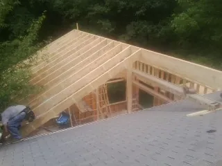 Framing a new roof addition that ties into an existing shingle roof in Terra Alta